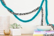 DIY Fingerknit Garlands styled on a wall