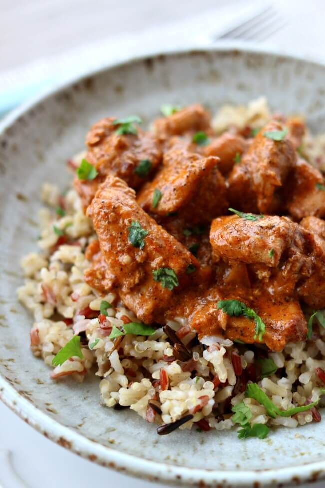 Slow Cooker Butter Chicken--tender, moist bites of chicken in a mildly spiced curry sauce made at home in your slow cooker. Pair it with some rice and Naan bread and you'll feel like you're at your favorite Indian restaurant.