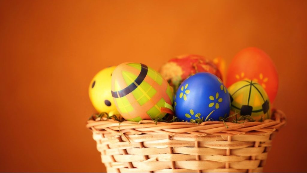 Painted eggs in a basket.