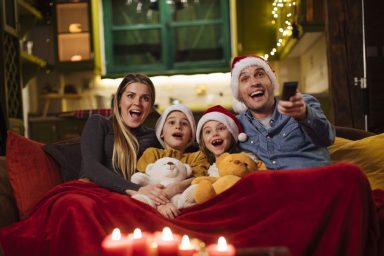 Family watching 2024 Christmas movies together.