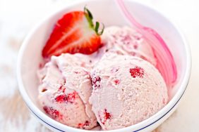 Strawberry cream ice cream in white bowl