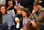 Actors Mila Kunis and Ashton Kutcher and their children look on during the WNBA basketball game between the Indiana Fever and the Los Angeles Sparks on May 24, 2024, at Crypto.com Arena in Los Angeles, CA.