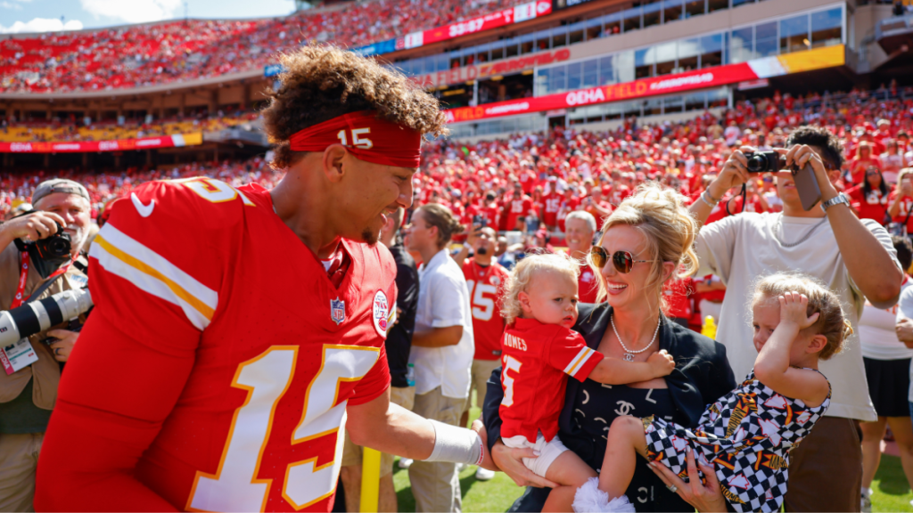 Patrick Mahomes #15 of the Kansas City Chiefs greets his wife, Brittany Mahomes and their two children Patrick Bronze Lavon Mahomes and Sterling Skye Mahomes prior to the game against the Cincinnati Bengals at GEHA Field at Arrowhead Stadium on September 15, 2024 in Kansas City, Missouri.