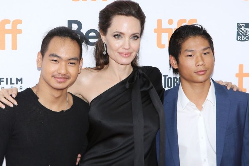 Angelina Jolie with her sons, Maddox Chivan Jolie-Pitt (L) and Pax Thien Jolie-Pitt arrive to "First They Killed My Father: A Daughter of Cambodia Remembers" premiere - 2017 TIFF - Premieres, Photo Calls and Press Conferences held on September 11, 2017 in Toronto, Canada.