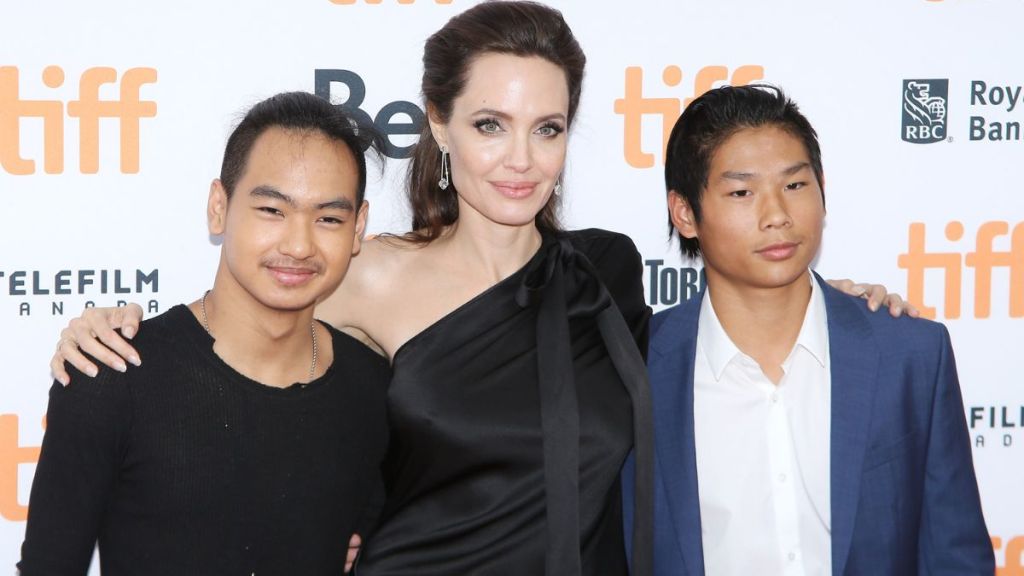 Angelina Jolie with her sons, Maddox Chivan Jolie-Pitt (L) and Pax Thien Jolie-Pitt arrive to "First They Killed My Father: A Daughter of Cambodia Remembers" premiere - 2017 TIFF - Premieres, Photo Calls and Press Conferences held on September 11, 2017 in Toronto, Canada.