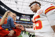 Patrick Mahomes #15 of the Kansas City Chiefs greets wife, Brittany, and daughter, Sterling, prior to a game against the Las Vegas Raiders at Allegiant Stadium on October 27, 2024 in Las Vegas, Nevada.