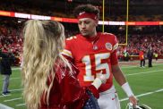 Patrick Mahomes #15 of the Kansas City Chiefs and his wife, Brittany Mahomes, embrace prior to the game against the Los Angeles Chargers at GEHA Field at Arrowhead Stadium on December 08, 2024 in Kansas City, Missouri.