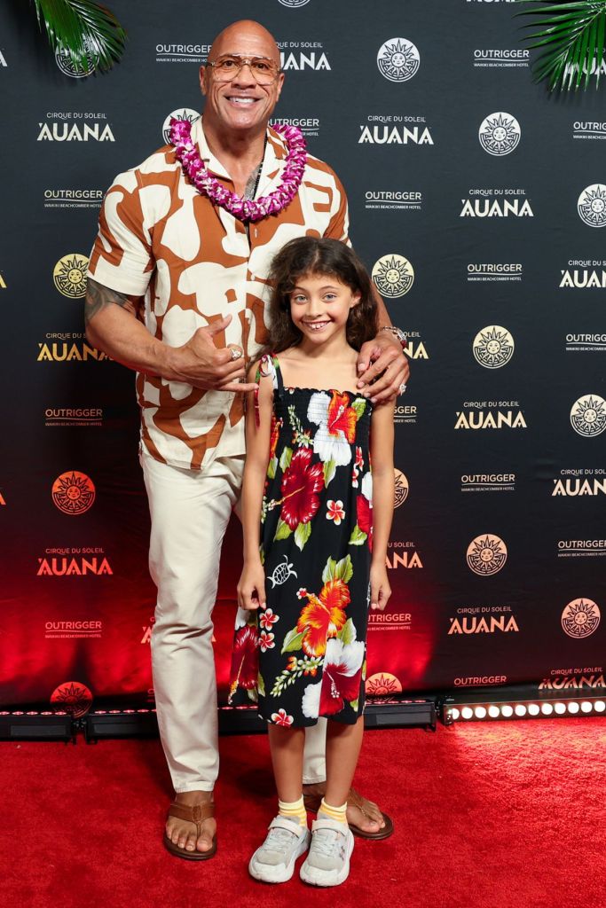 Dwayne "The Rock" Johnson, left, and his daughter Jasmine Johnson, joins cast and cultural visionaries, applauding the global premiere of Cirque du Soleil 'Auana at the OUTRIGGER Waikiki Beachcomber Hotel, a show blending Hawaiian legends with Cirque's iconic acrobatics.