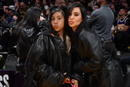 Kim Kardashian (R) and North West attend a basketball game between the Los Angeles Lakers and the Golden State Warriors at Crypto.com Arena on April 09, 2024 in Los Angeles, California.