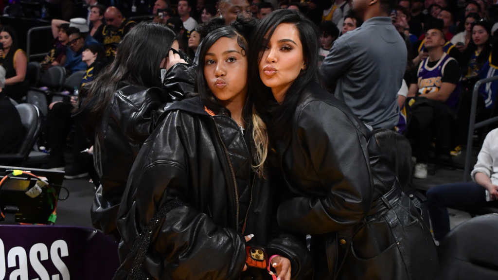 Kim Kardashian (R) and North West attend a basketball game between the Los Angeles Lakers and the Golden State Warriors at Crypto.com Arena on April 09, 2024 in Los Angeles, California.