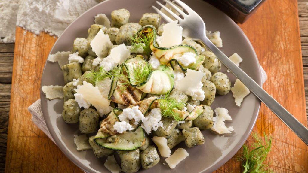 spinach gnocchi with ricotta, zucchinis and parmesan flakes italian recipe