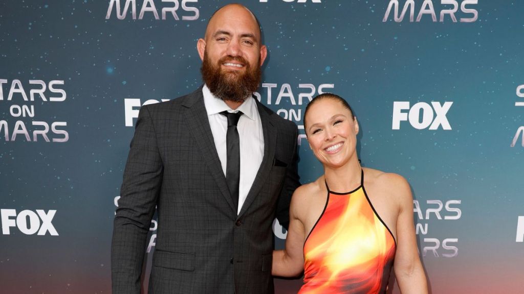 Travis Browne and Ronda Rousey attend FOX's Stars On Mars "The Mars Bar" VIP red carpet press preview at Scum and Villainy Cantina on June 01, 2023 in Hollywood, California.