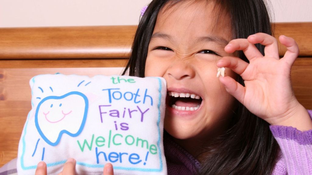 Cute little girl ready for the Tooth Fairy to come with a DIY pillow