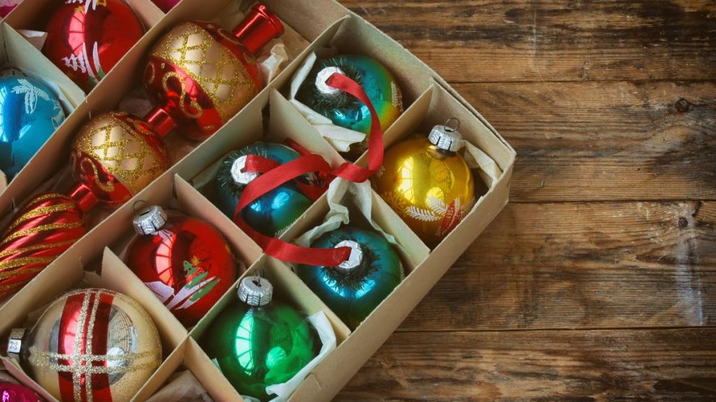 set of vintage Christmas decoration in box, tip, on wooden table