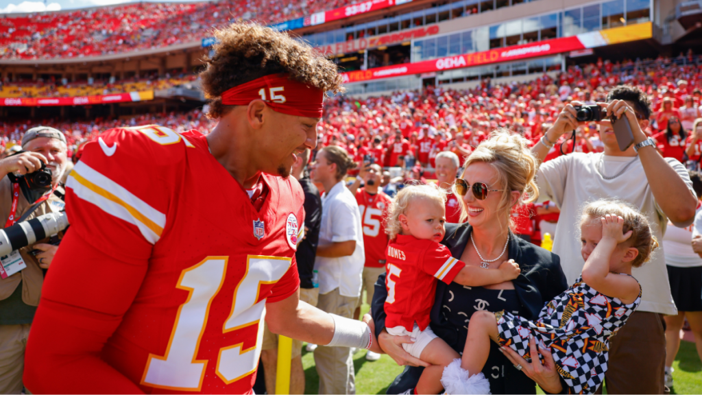 Patrick Mahomes #15 of the Kansas City Chiefs greets his wife, Brittany Mahomes and their two children Patrick Bronze Lavon Mahomes and Sterling Skye Mahomes prior to the game against the Cincinnati Bengals at GEHA Field at Arrowhead Stadium on September 15, 2024 in Kansas City, Missouri.