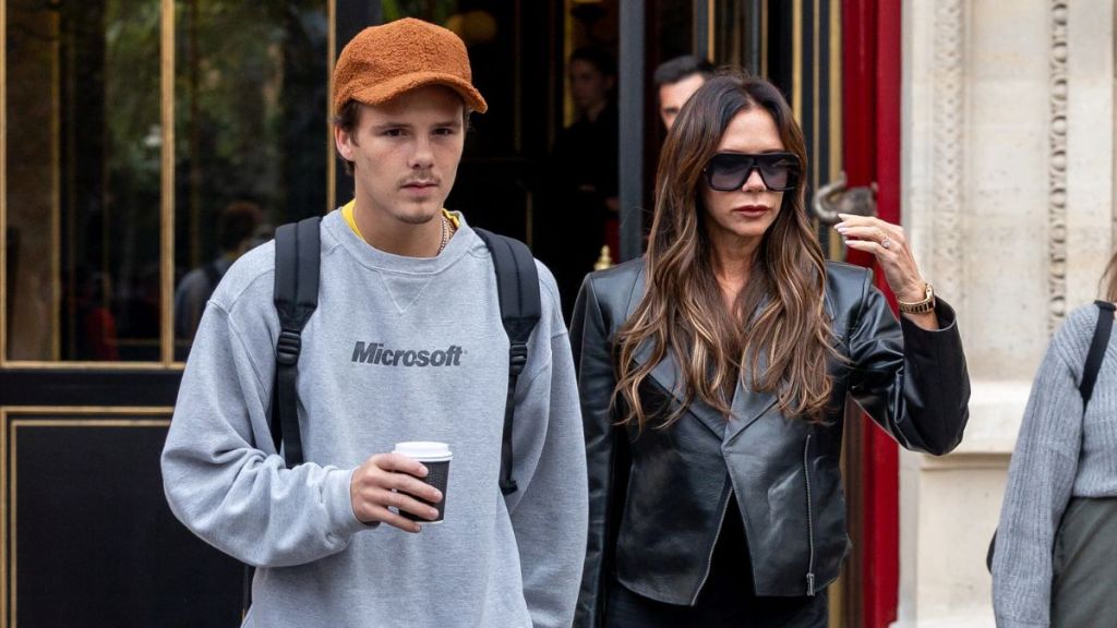 Victoria Beckham (R) and son Cruz Beckham are seen on September 30, 2023 in Paris, France.